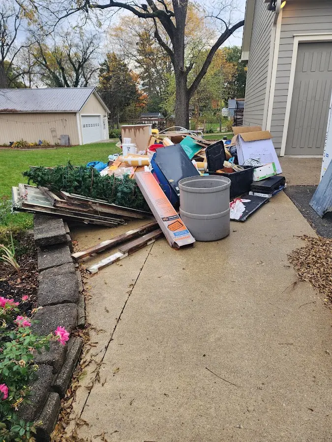Dumpster being loaded with debris for Commercial Dumpster Rental in Ironton